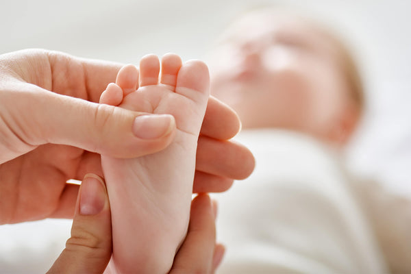 mum touching her baby's foot